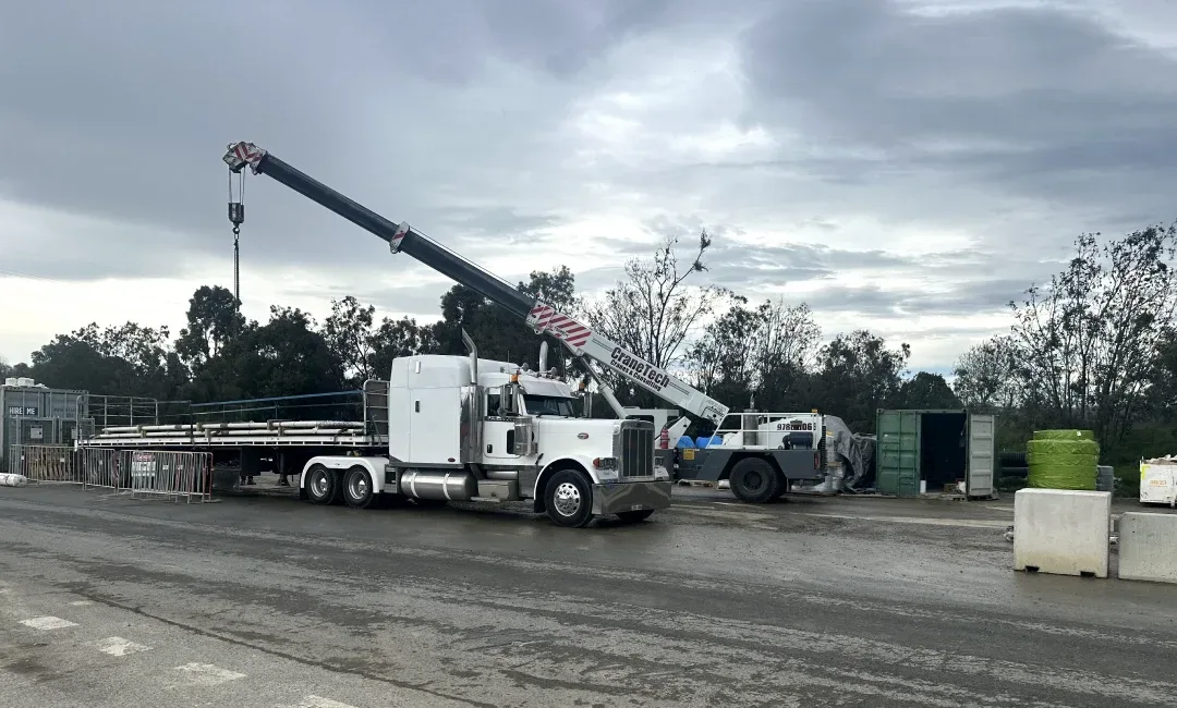 Truck delivering steel products from Newcastle into Melbourne's North East Link Project