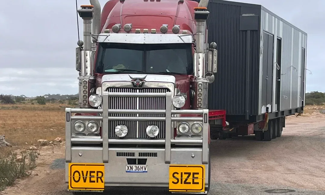 Truck delivering oversized buildings from Melbourne to Perth Quarantine center